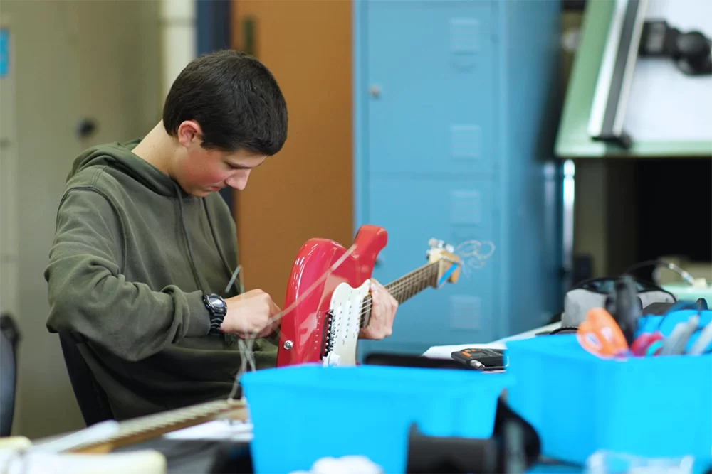 Certificate IV Musical Instrument Making and Repair student making an electric guitar